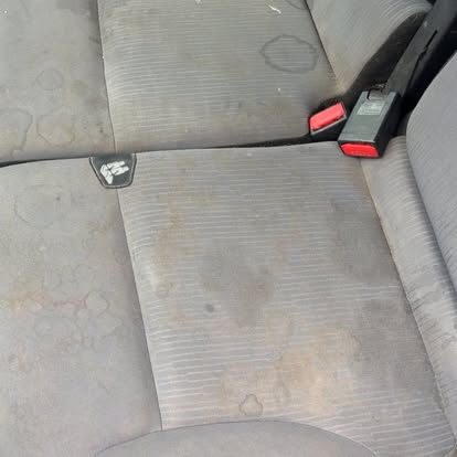 Stained car seat before cleaning