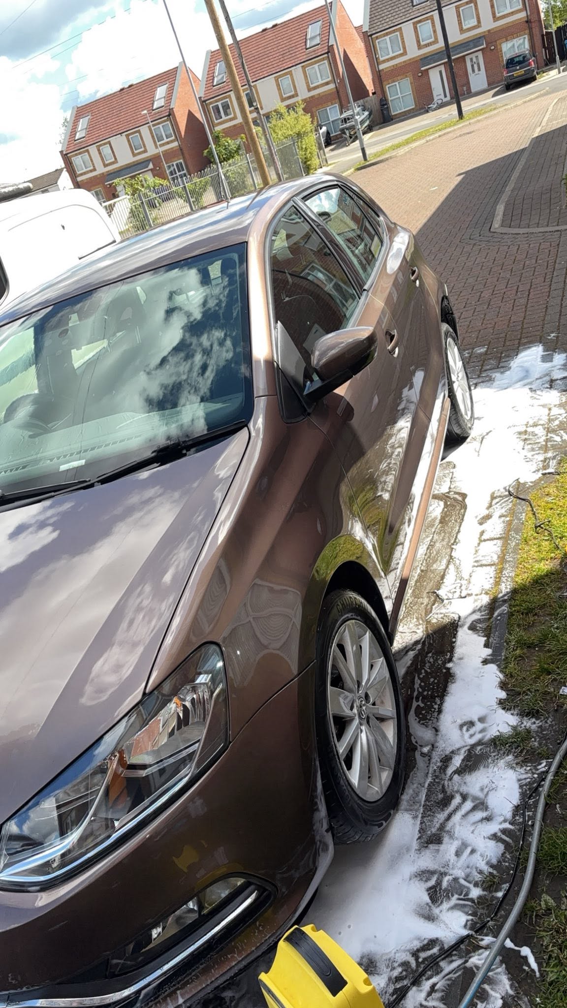 Freshly washed brown saloon with a gloss finish